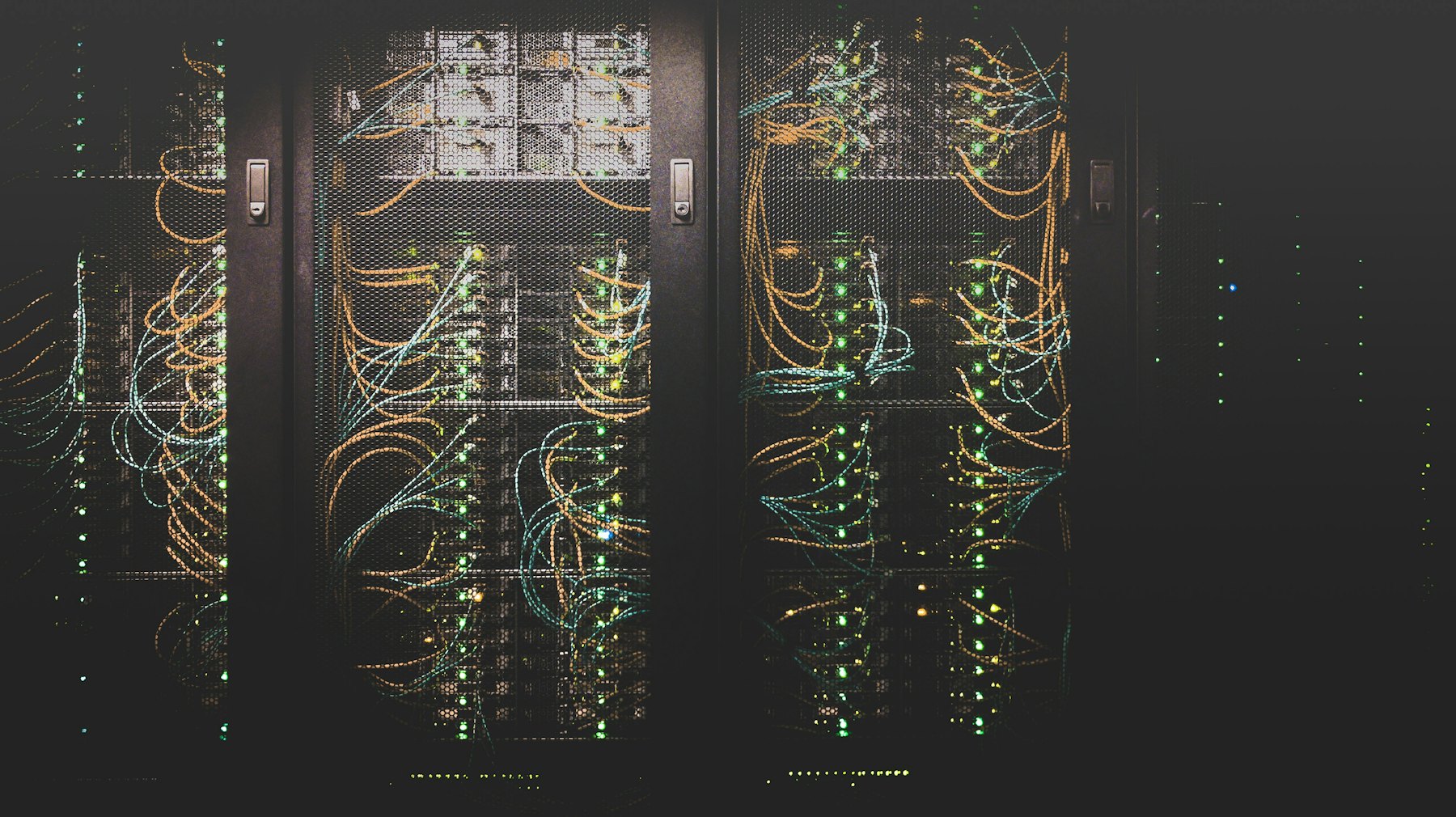 Network equipment lit in a dark server cabinet
